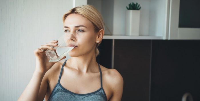 Woman drinking water important for oral health dentist in Durham North Carolina